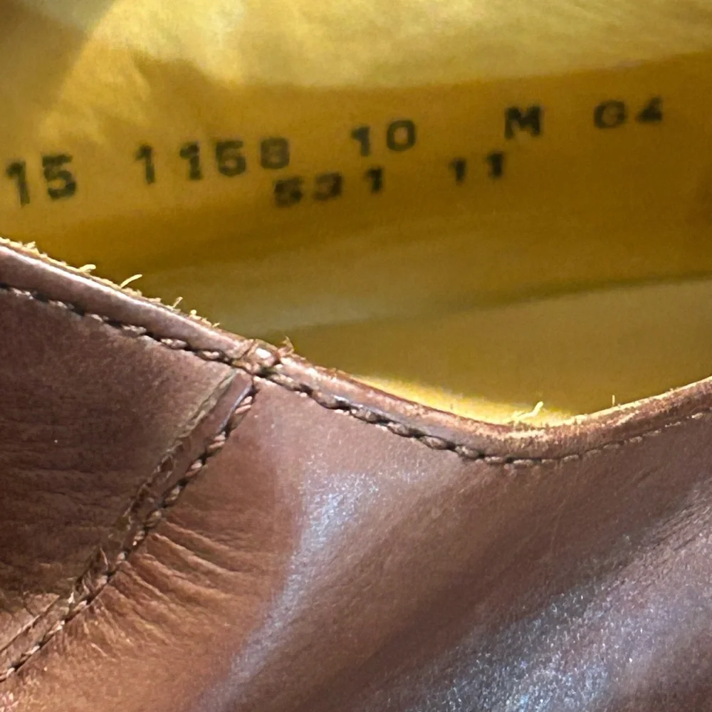 Johnston & Murphy brown leather split-toe derby dress shoe.